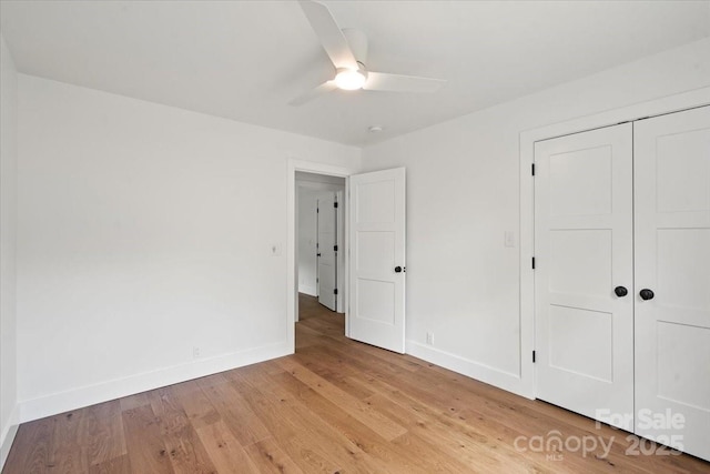 2429/2425 Ellen Ave, Charlotte, NC 28208 - unfurnished bedroom with ceiling fan, baseboards, a closet, and light wood-type flooring