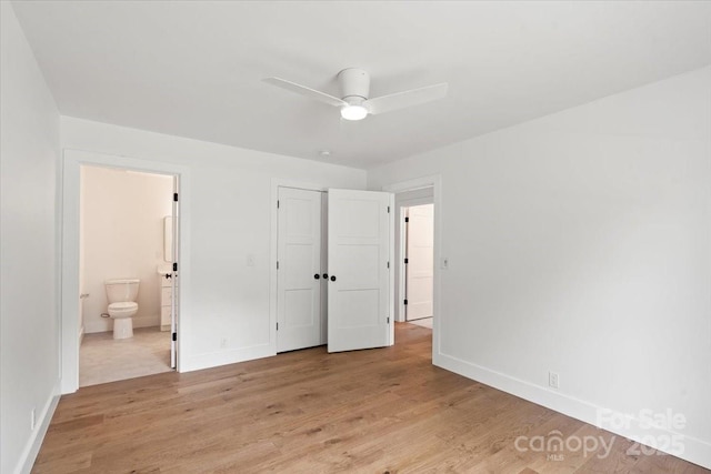 2429/2425 Ellen Ave, Charlotte, NC 28208 - unfurnished bedroom with baseboards, a closet, light wood-style floors, and ensuite bathroom