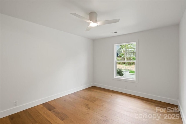 2429/2425 Ellen Ave, Charlotte, NC 28208 - empty room with hardwood / wood-style flooring, visible vents, a ceiling fan, and baseboards