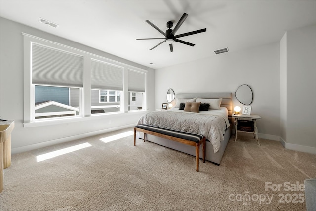 bedroom featuring visible vents, baseboards, carpet floors, and ceiling fan
