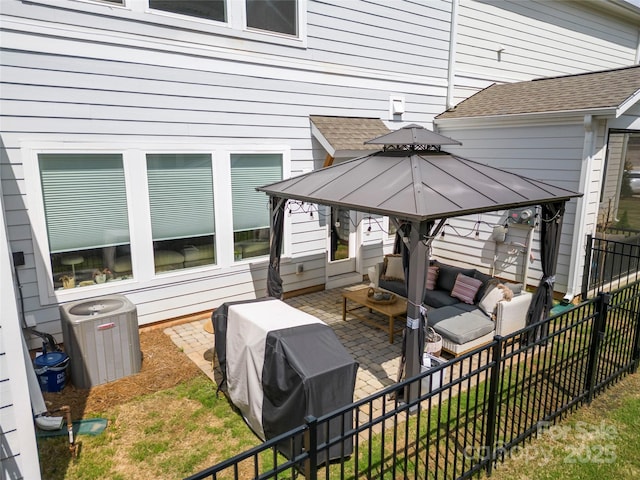 view of patio with a gazebo, central AC, grilling area, outdoor lounge area, and a fenced backyard