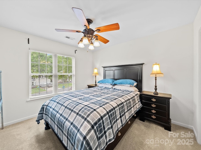 bedroom featuring visible vents, ceiling fan, light colored carpet, and baseboards