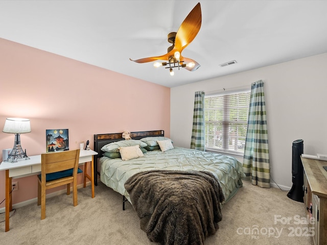 bedroom featuring light colored carpet, visible vents, ceiling fan, and baseboards