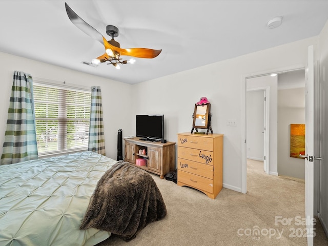 bedroom featuring visible vents, ceiling fan, light colored carpet, and baseboards