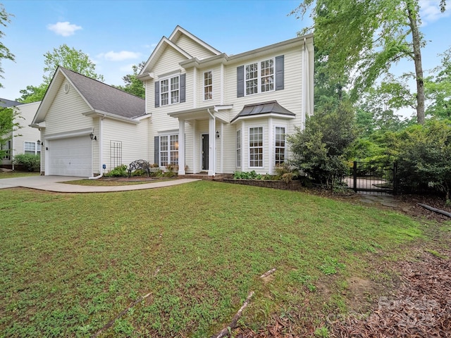 traditional home featuring concrete driveway, a front lawn, a garage, and fence