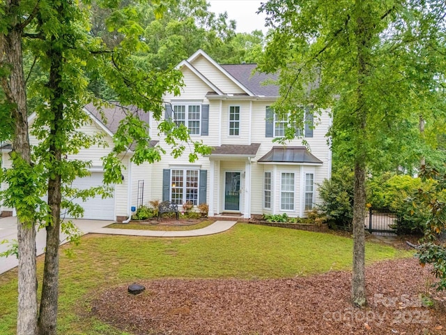 view of front of home with driveway, fence, a front yard, and a shingled roof
