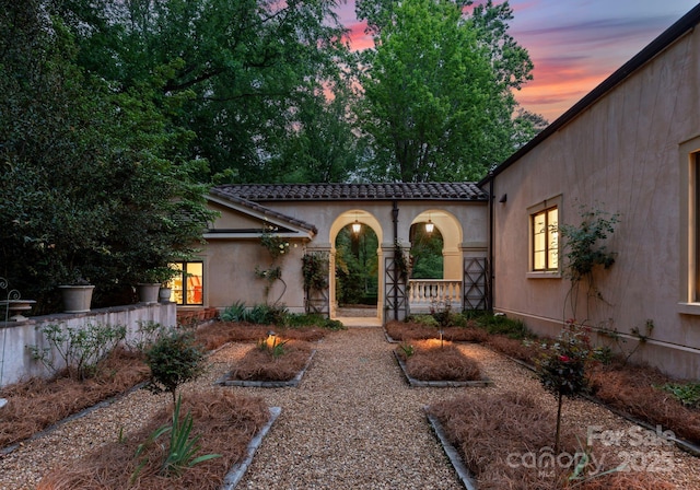 5030 Hardison Rd, Charlotte, NC 28226 - view of front of home featuring a tiled roof and stucco siding