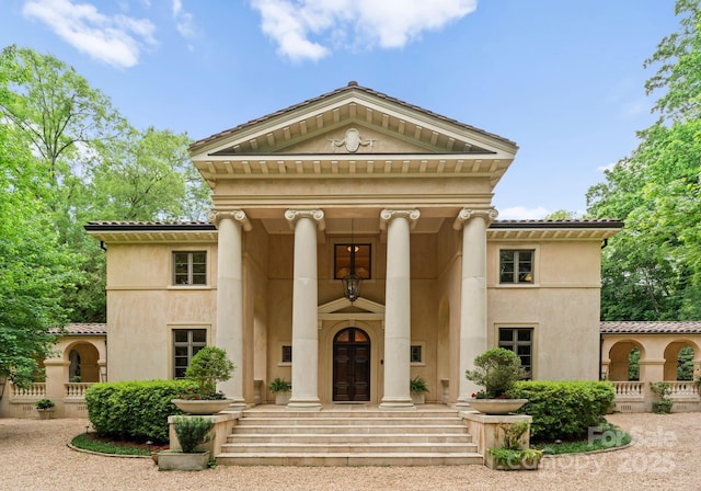5030 Hardison Rd, Charlotte, NC 28226 - view of front of property with stucco siding and a tile roof