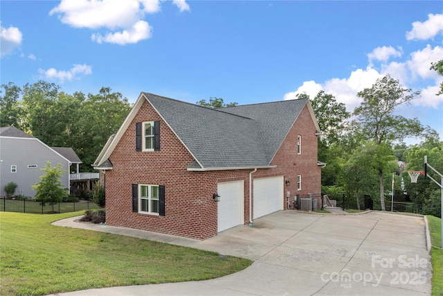 444 Snapdragon Dr, Clover, SC 29710 - view of side of property with brick siding, roof with shingles, concrete driveway, an attached garage, and central AC