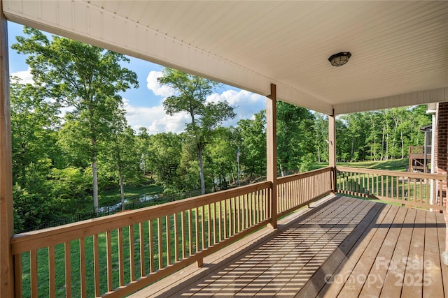 444 Snapdragon Dr, Clover, SC 29710 - wooden deck with a lawn and view of wooded area