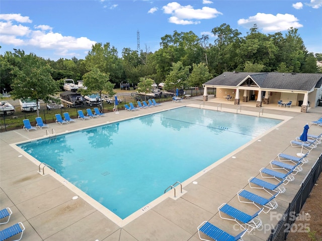 444 Snapdragon Dr, Clover, SC 29710 - community pool featuring fence, a patio, and view of wooded area
