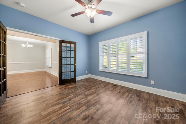 444 Snapdragon Dr, Clover, SC 29710 - unfurnished room featuring wood finished floors, a chandelier, baseboards, and a smoke detector