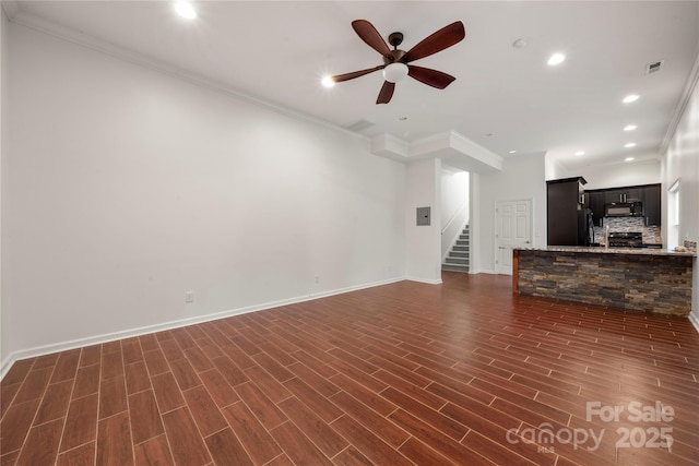 444 Snapdragon Dr, Clover, SC 29710 - unfurnished living room with a ceiling fan, ornamental molding, stairway, dark wood-style flooring, and baseboards