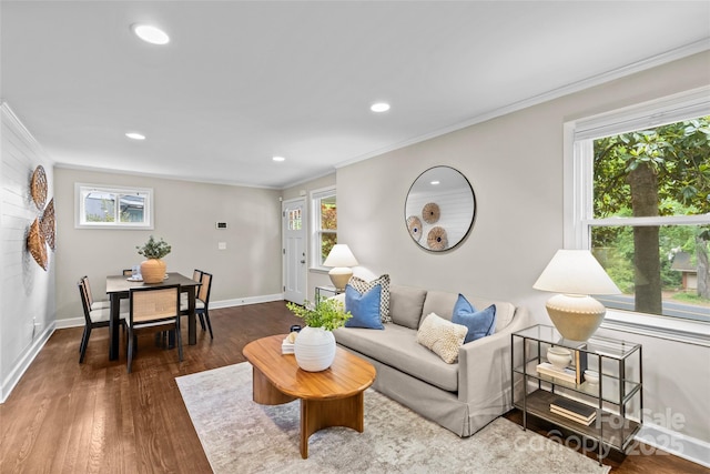 living area featuring recessed lighting, ornamental molding, baseboards, and wood finished floors