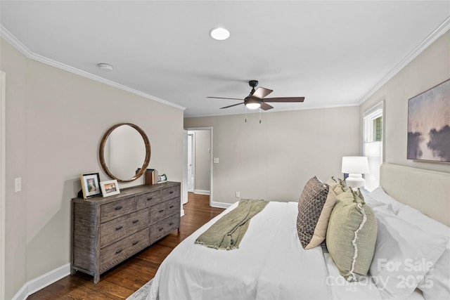bedroom with baseboards, ornamental molding, and dark wood-style flooring