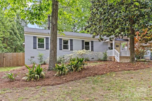 single story home with fence and crawl space