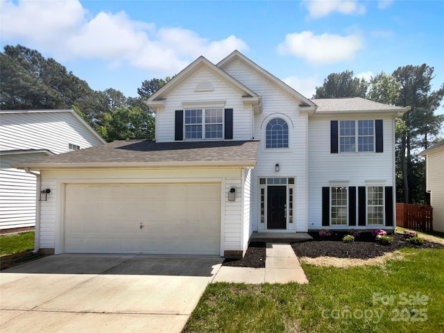 9830 Sandman Ln, Charlotte, NC 28216 - traditional-style house with concrete driveway, fence, and a shingled roof