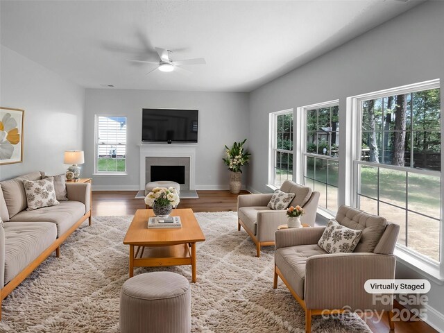 9830 Sandman Ln, Charlotte, NC 28216 - living room featuring baseboards, wood finished floors, a fireplace, and ceiling fan