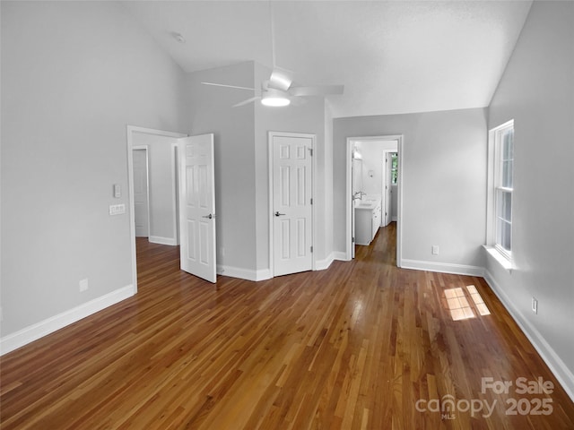 9830 Sandman Ln, Charlotte, NC 28216 - unfurnished bedroom featuring baseboards and wood finished floors