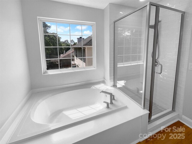 9830 Sandman Ln, Charlotte, NC 28216 - full bathroom featuring a bath and a stall shower