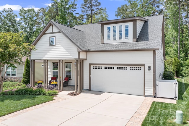 4902 Looking Glass Trl, Denver, NC 28037 - view of front facade featuring roof with shingles, concrete driveway, a front lawn, and a garage