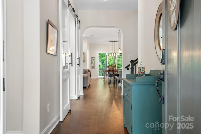 4902 Looking Glass Trl, Denver, NC 28037 - corridor with arched walkways, baseboards, and dark wood-type flooring
