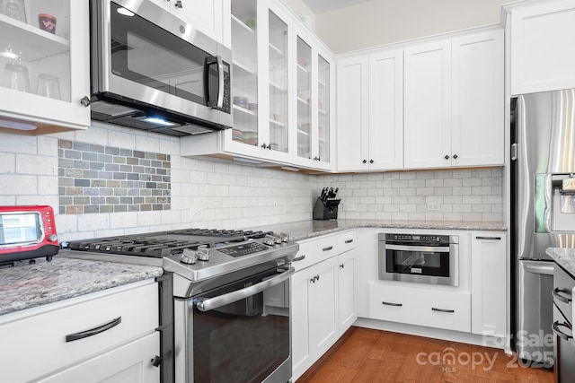 4902 Looking Glass Trl, Denver, NC 28037 - kitchen with appliances with stainless steel finishes, white cabinets, and glass insert cabinets