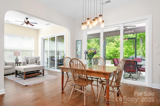 4902 Looking Glass Trl, Denver, NC 28037 - dining area featuring arched walkways, ceiling fan, and a wealth of natural light