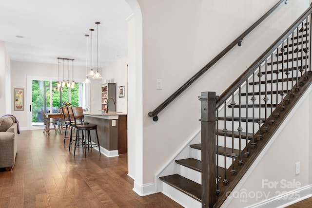 4902 Looking Glass Trl, Denver, NC 28037 - stairs with baseboards, arched walkways, and wood finished floors