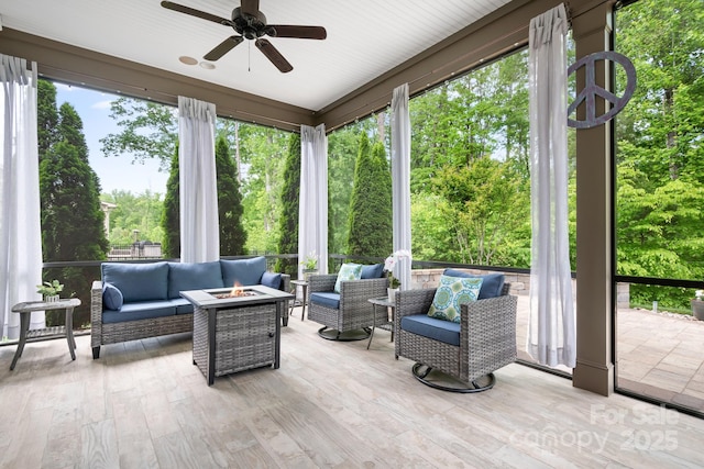 4902 Looking Glass Trl, Denver, NC 28037 - sunroom featuring a ceiling fan, wood finished floors, and an outdoor living space with a fire pit