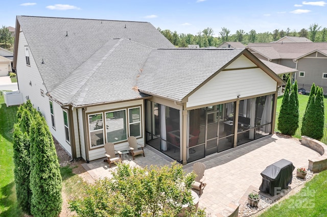 4902 Looking Glass Trl, Denver, NC 28037 - rear view of property featuring a shingled roof, a sunroom, and a patio area