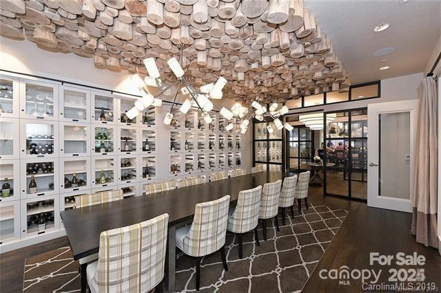 4902 Looking Glass Trl, Denver, NC 28037 - wine area with recessed lighting, an inviting chandelier, and dark wood-type flooring