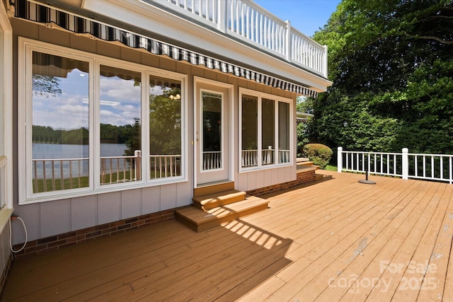 wooden deck with a water view
