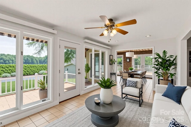 sunroom / solarium featuring french doors