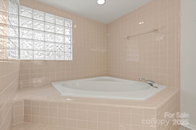 full bathroom featuring a relaxing tiled tub