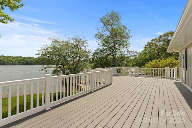 wooden deck with a water view