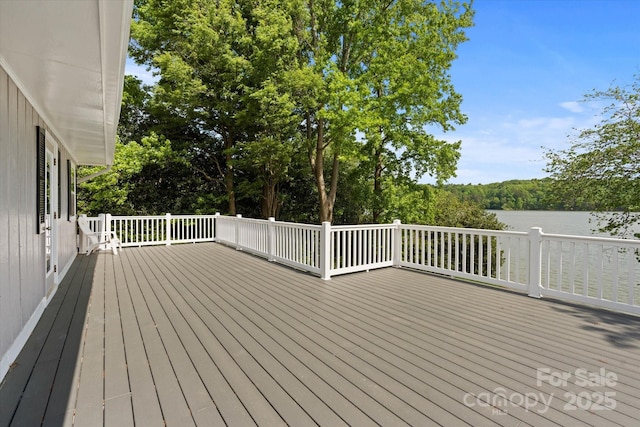 wooden deck featuring a water view