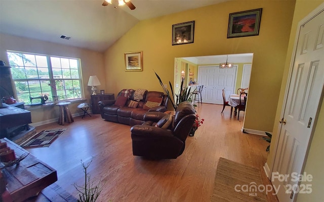 6454 Sain Milling Rd, Vale, NC 28168 - living area with a ceiling fan, vaulted ceiling, wood finished floors, and baseboards