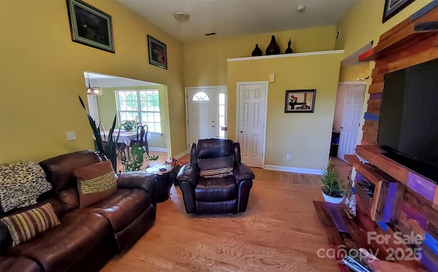 6454 Sain Milling Rd, Vale, NC 28168 - living area featuring wood finished floors, baseboards, and a high ceiling