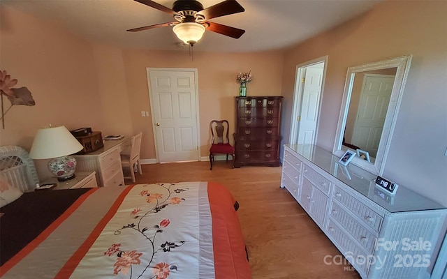 6454 Sain Milling Rd, Vale, NC 28168 - bedroom with baseboards, a ceiling fan, and wood finished floors