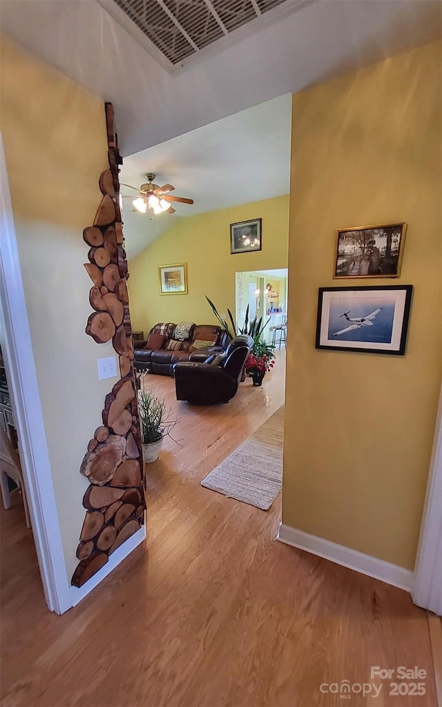 6454 Sain Milling Rd, Vale, NC 28168 - hallway with lofted ceiling, baseboards, visible vents, and wood finished floors