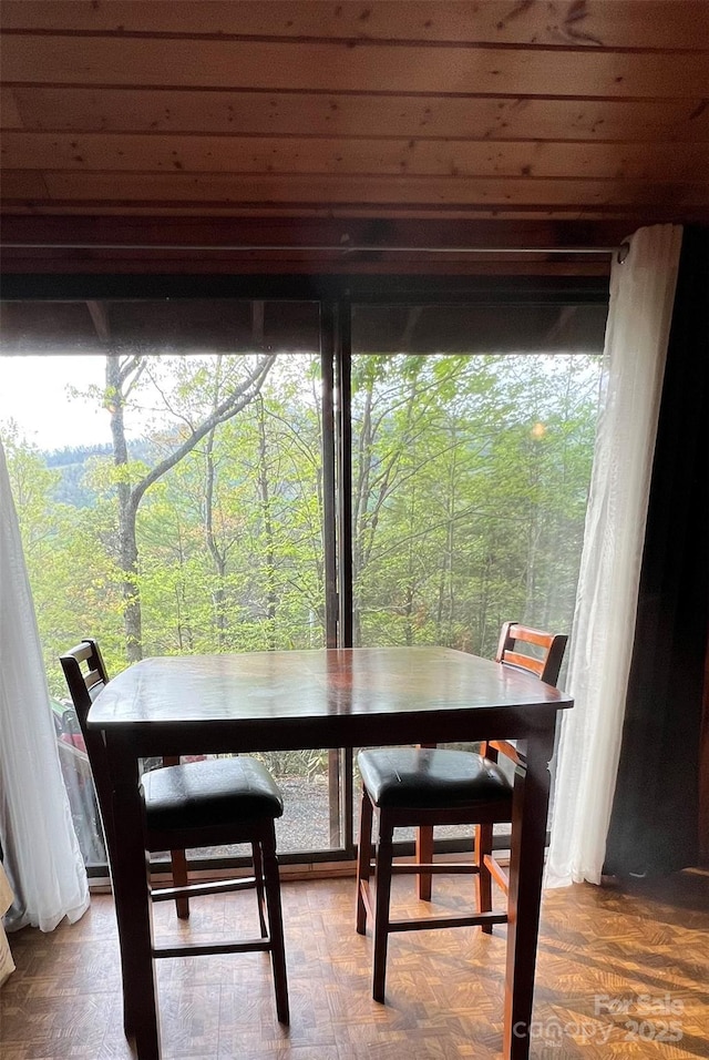 dining area with a forest view