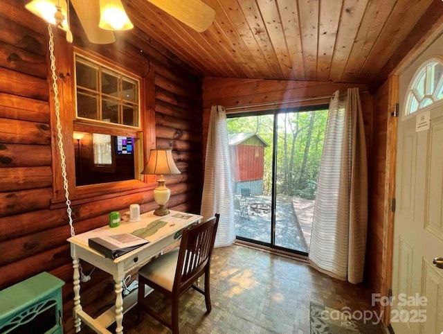 dining space with rustic walls, a healthy amount of sunlight, and wood ceiling