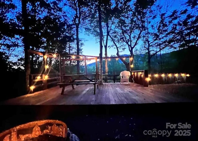 exterior space featuring a fire pit and a deck