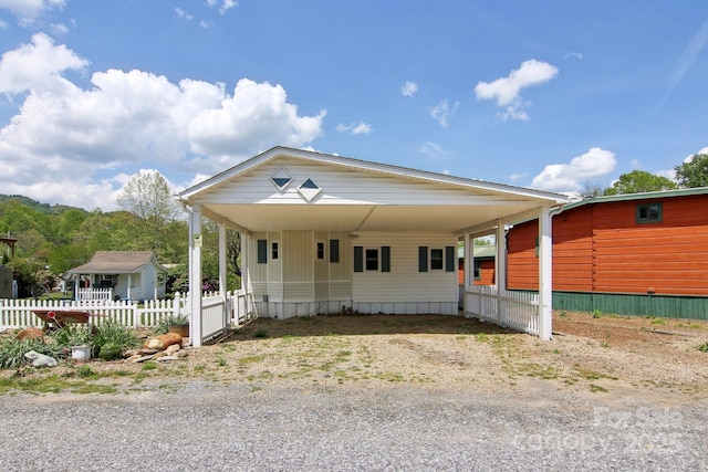 222 Pike Pt, Waynesville, NC 28785 - manufactured / mobile home featuring fence, an attached carport, and driveway