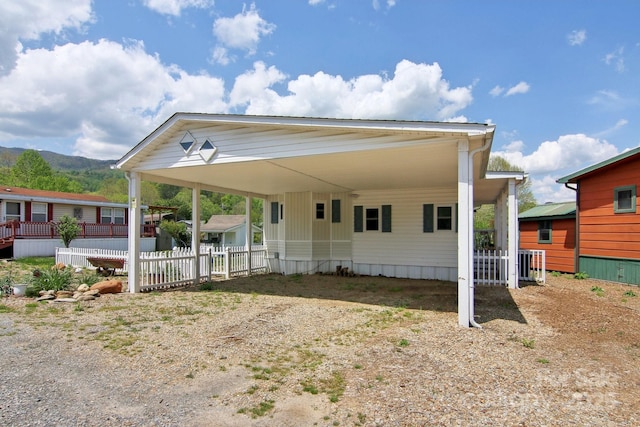 222 Pike Pt, Waynesville, NC 28785 - view of front of house with fence, a carport, and dirt driveway