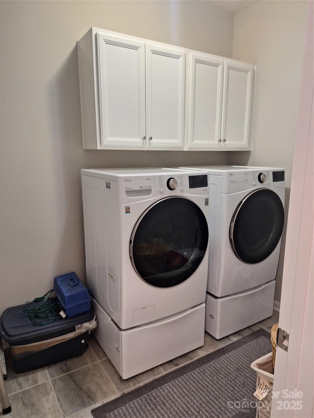 1202 Calder Dr, Indian Trail, NC 28079 - clothes washing area with washing machine and clothes dryer and cabinet space