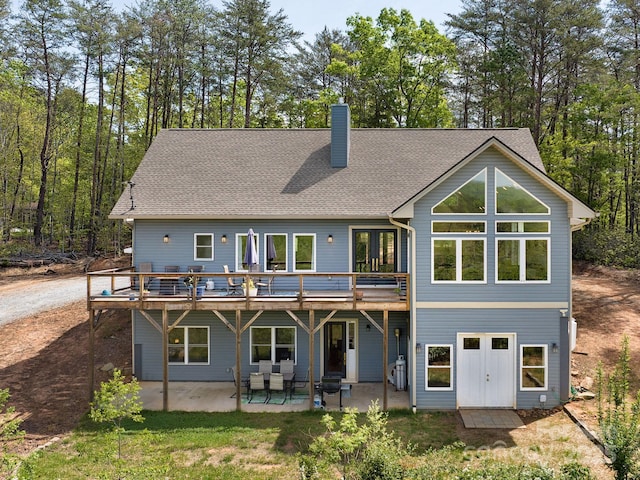 1810 Coopers Gap Rd, Mill Spring, NC 28756 - back of property with a wooden deck, a patio, and a chimney