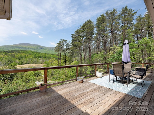 1810 Coopers Gap Rd, Mill Spring, NC 28756 - wooden deck with a view of trees, a mountain view, and outdoor dining area