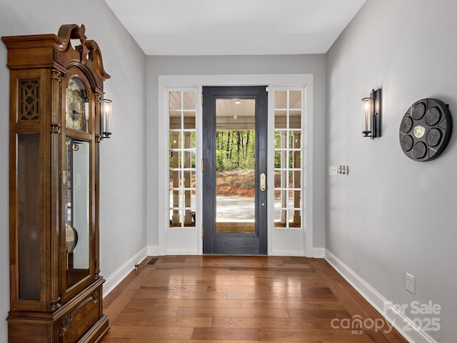1810 Coopers Gap Rd, Mill Spring, NC 28756 - doorway to outside featuring baseboards, dark wood-style floors, and visible vents
